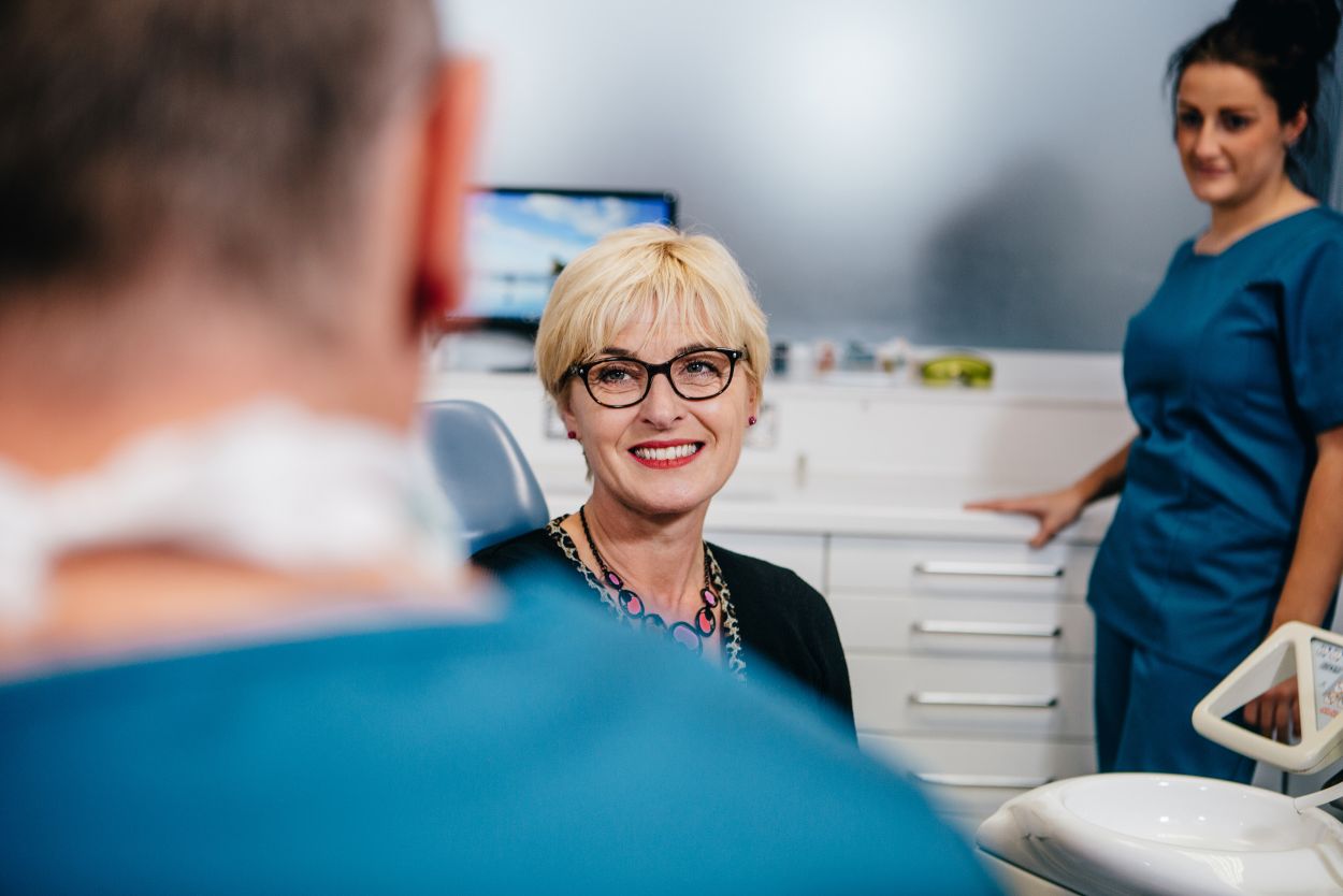 Dentist discussing denture options with a patient at Castelnau Dentists in Barnes